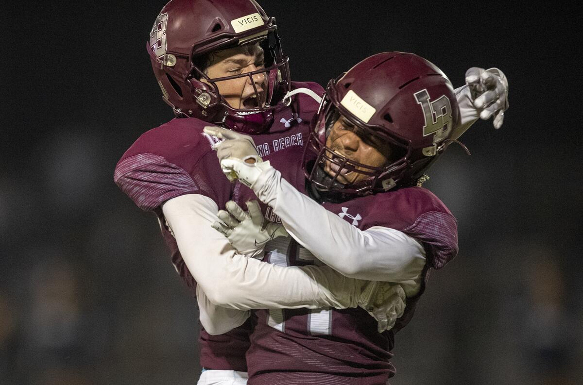 Laguna Beach's Shia Castillo, left, celebrates with Jackson Rodriguez after scoring in a nonleague game against Northwood.
