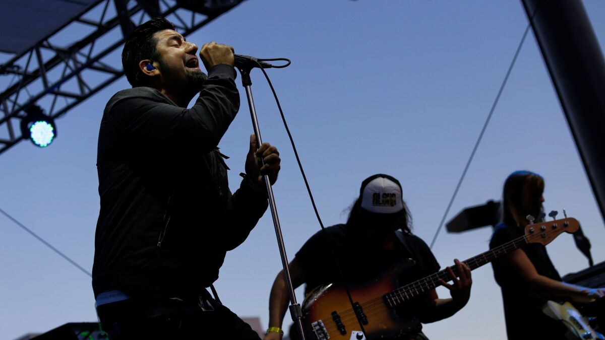 Deftones lead singer Chino Moreno, left, performs at the 2014 Sunset Strip Music Festival.
