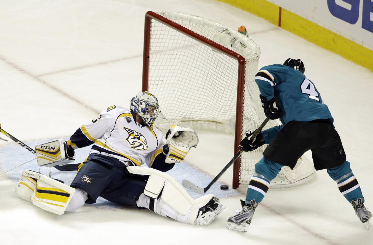 Sharks tk Joel Ward scores on Predators goalie Pekka Rinne during the third period of Game 1 of the teams' second-round playoff series on April 29.