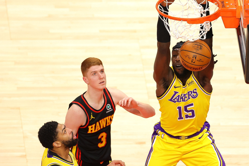 The Lakers' Montrezl Harrell dunks against the Hawks' Kevin Huerter during the first half Feb. 1, 2021.