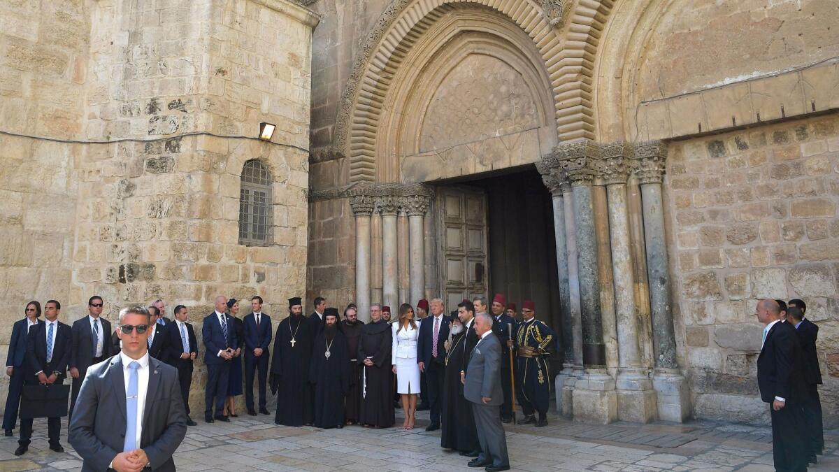 President Trump and First Lady Melania Trump, center, visit the Church of the Holy Sepulchre in Jerusalem on Monday.