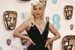 Lady Gaga poses for photographers upon arrival at the 75th British Academy Film Awards, BAFTA's, in London Sunday, March 13, 2022. (Photo by Joel C Ryan/Invision/AP)