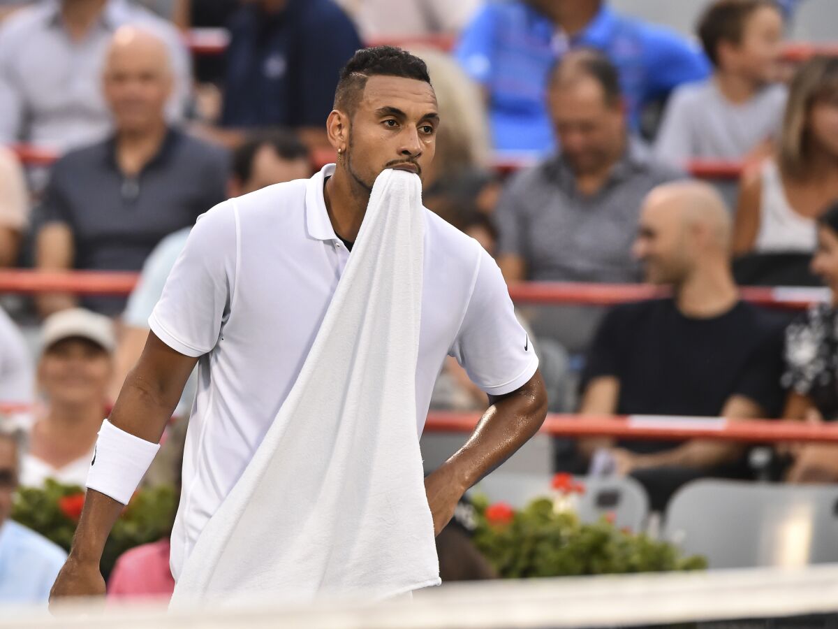 MONTREAL, QC - AUGUST 06: Nick Kyrgios of Australia holds his towel in his mouth against Kyle Edmund of Great Britain during day 5 of the Rogers Cup at IGA Stadium on August 6, 2019 in Montreal, Quebec, Canada. (Photo by Minas Panagiotakis/Getty Images) ** OUTS - ELSENT, FPG, CM - OUTS * NM, PH, VA if sourced by CT, LA or MoD **