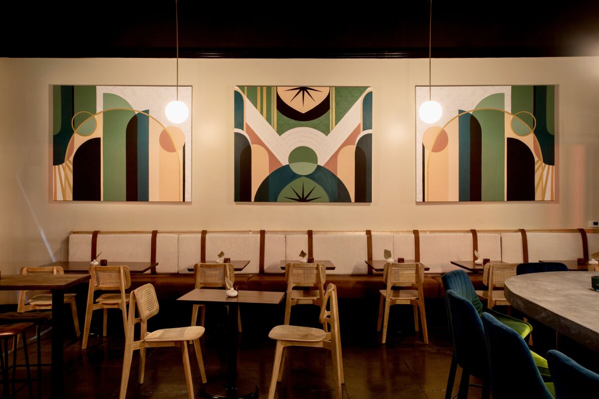 The dining room at PUBlic Legacy, a 174-seat restaurant in Orange, features original artwork.