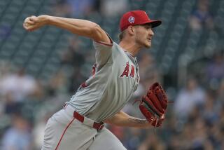 Los Angeles Angels starting pitcher Jack Kochanowicz delivers during the first inning of a baseball game against the Minnesota Twins, Wednesday, Sept. 11, 2024, in Minneapolis. (AP Photo/Abbie Parr)