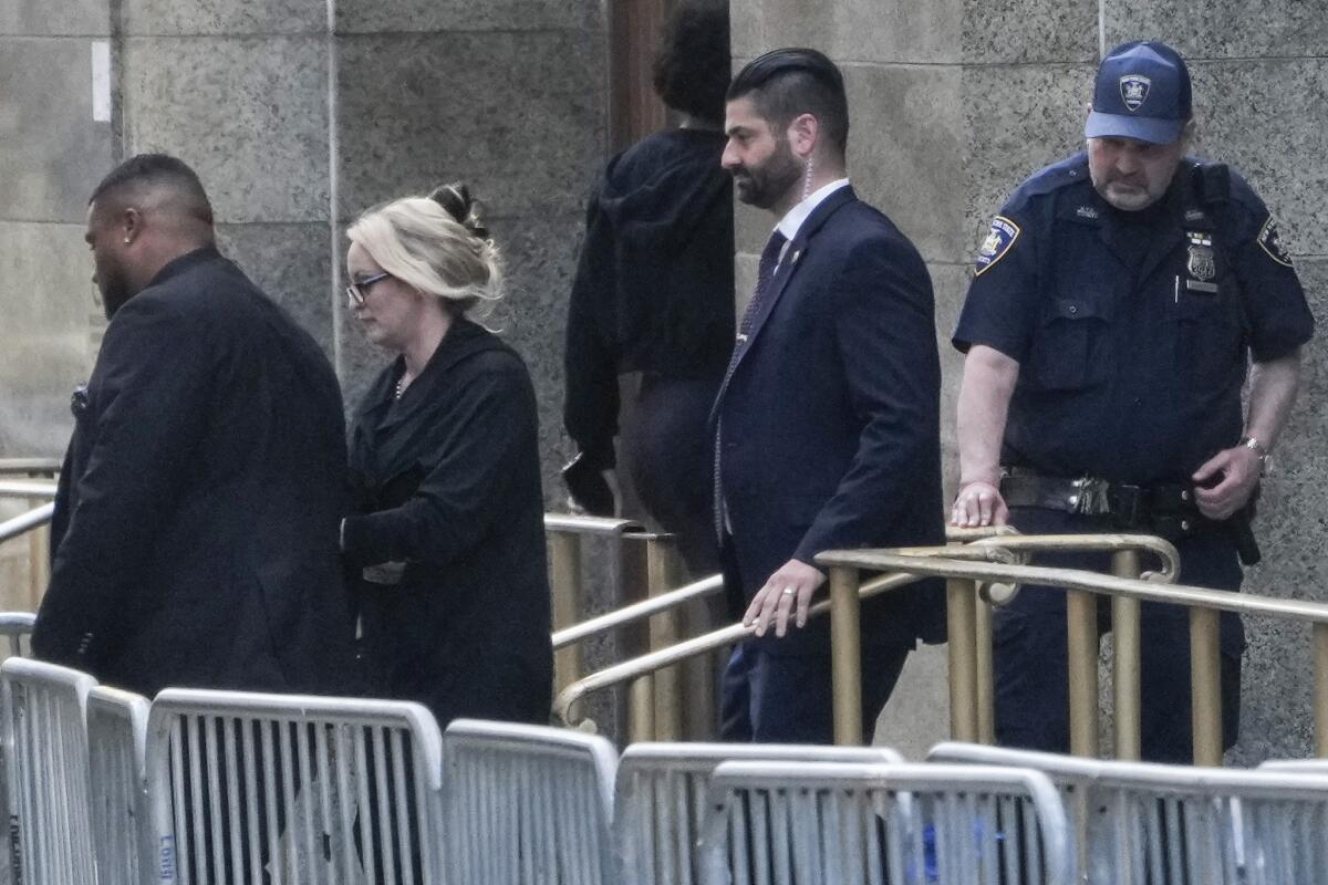 Stormy Daniels walks through barricades out of court.