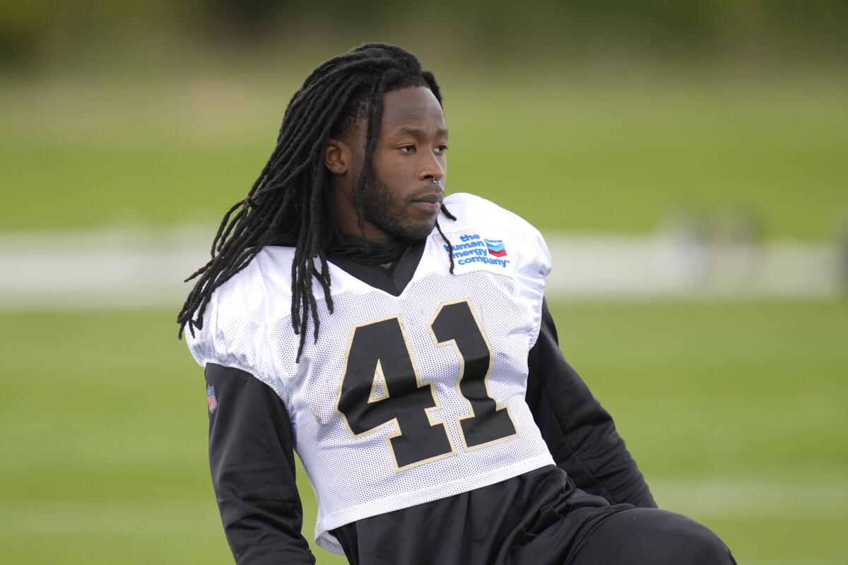 New Orleans Saints running back Alvin Kamara looks on during an NFL practice session at the London Irish rugby team training ground in Sunbury-on-Thames near London, Wednesday, Sept. 28, 2022 ahead of the NFL game against Minnesota Vikings at the Tottenham Hotspur stadium on Sunday. (AP Photo/Kirsty Wigglesworth)