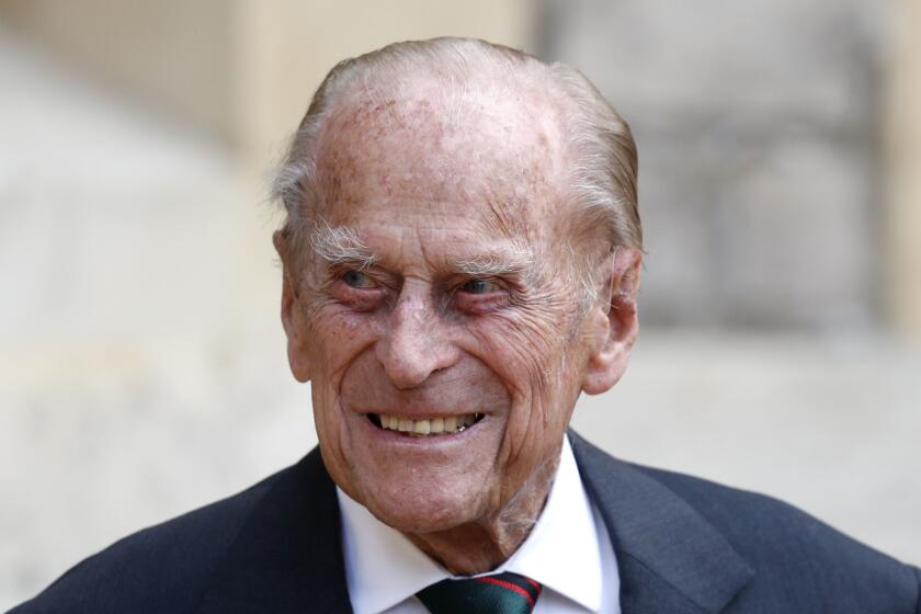 FILE - In this Wednesday July 22, 2020 file photo, Britain's Prince Philip arrives for a ceremony for the transfer of the Colonel-in-Chief of the Rifles from himself to Camilla, Duchess of Cornwall, at Windsor Castle, England. Buckingham Palace says 99-year-old Prince Philip has been admitted to a London hospital after feeling unwell. The palace says the husband of Queen Elizabeth II was admitted to the King Edward VII Hospital on the evening of Tuesday Feb. 16, 2021. (Adrian Dennis/Pool via AP, File)