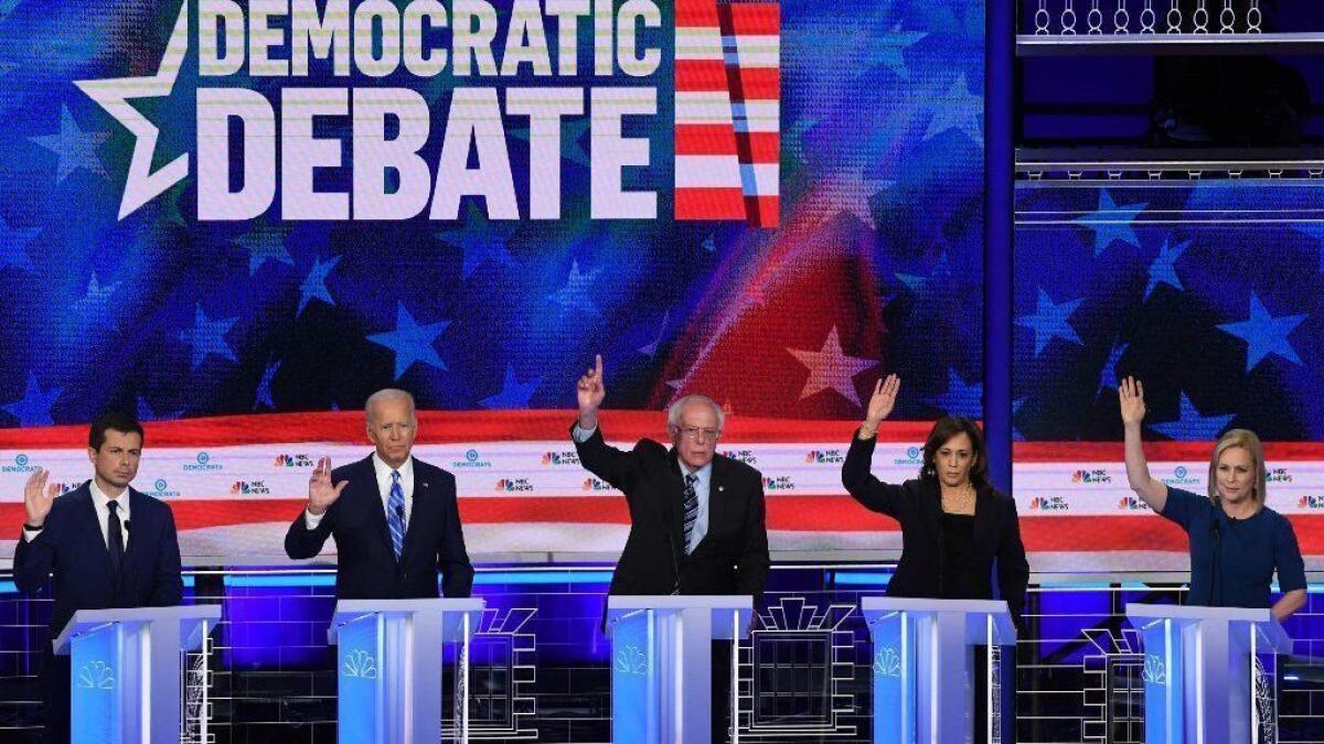 South Bend, Ind., Mayor Pete Buttigieg, former Vice President Joe Biden and Sens. Bernie Sanders (I-Vt.), Kamala Harris (D-Calif.) and Kirsten Gillibrand (D-N.Y.) participate in the second Democratic primary debate in Miami on Thursday.