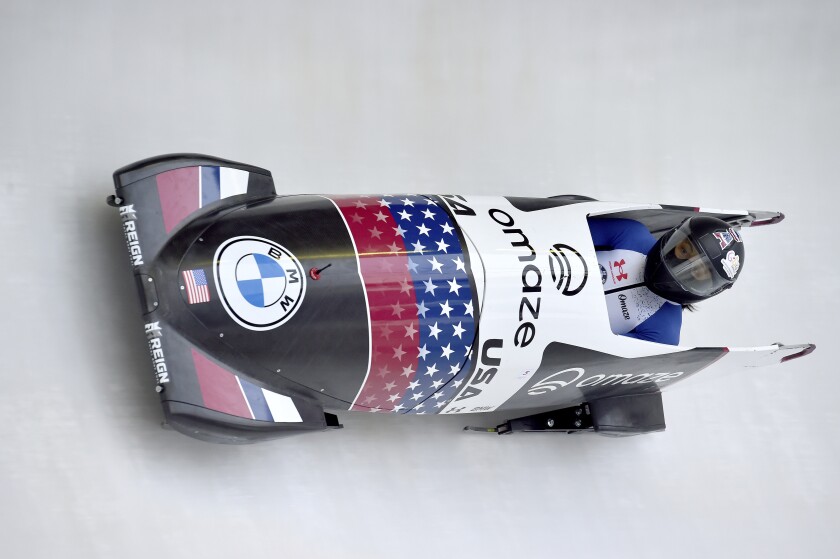 Elena Meyers Taylor from the USA drives through the ice track, during a women's monobob heat, during the Bobsleigh World Cup, in Winterberg, Germany, Saturday, Jan. 8, 2022. (Caroline Seidel/dpa via AP)