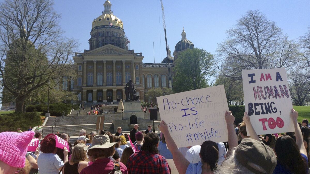 Planned Parenthood supporters rally outside the Iowa Capitol Building in Des Moines in May.