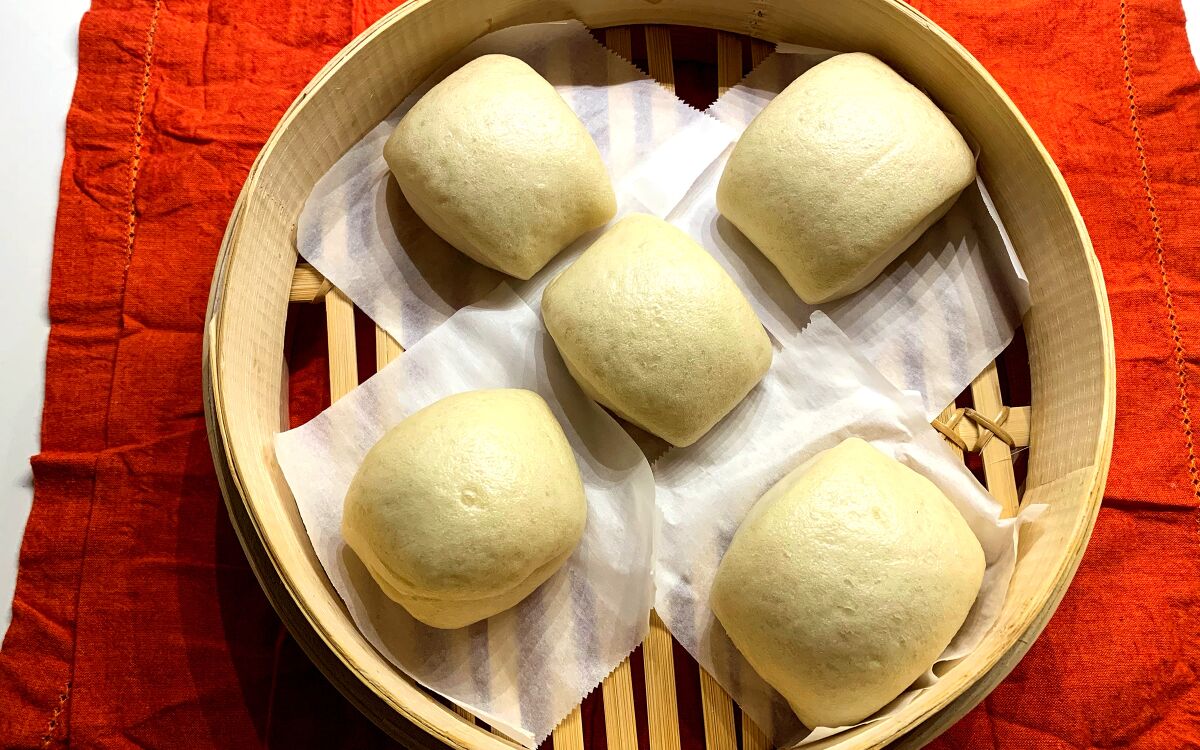 Mantou steamed Chinese buns are made on the stovetop.