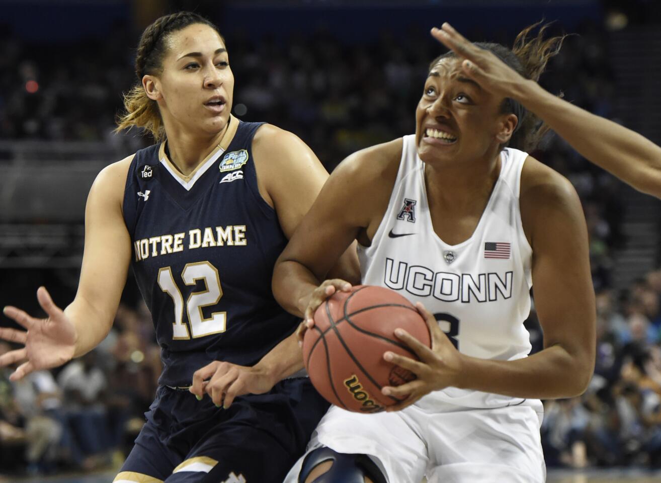 Notre Dame's Taya Reimer defends Morgan Tuck in the 1st half. UConn plays Notre Dame for the National Championship at Amalie Arena in Tampa, Florida.