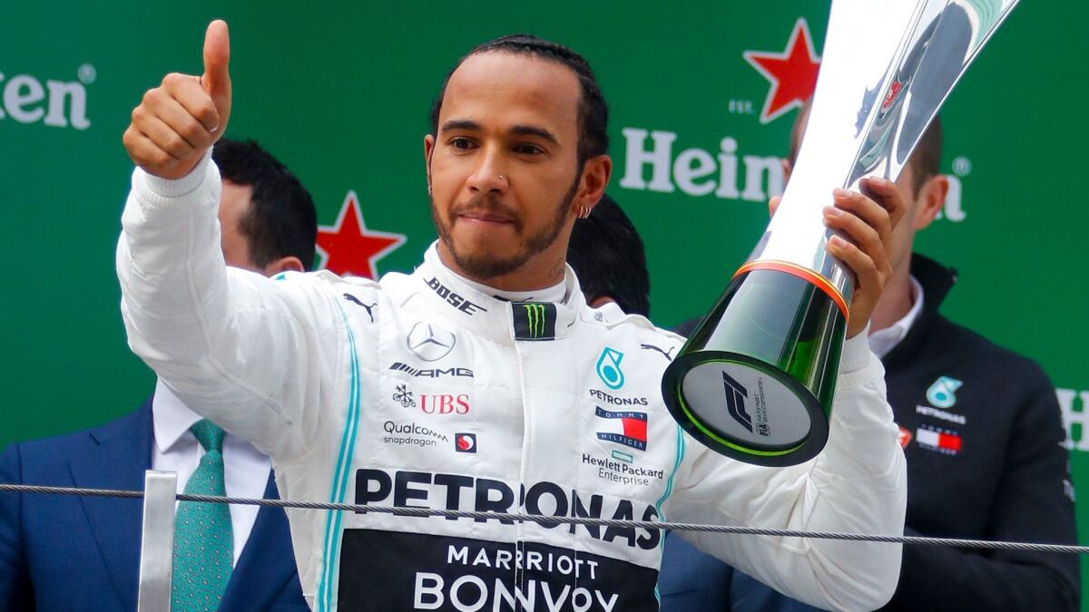 Lewis Hamilton celebrates after winning the Formula One Chinese Grand Prix on Sunday.