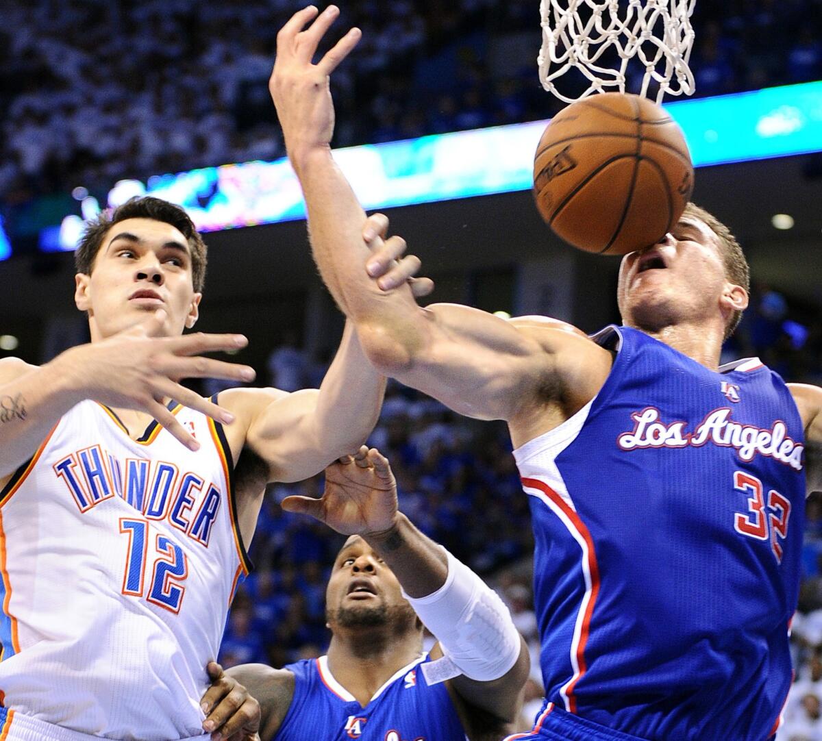The Clippers' Blake Griffin battles Oklahoma City's Steven Adams and the ball in Game 2 of their playoff.