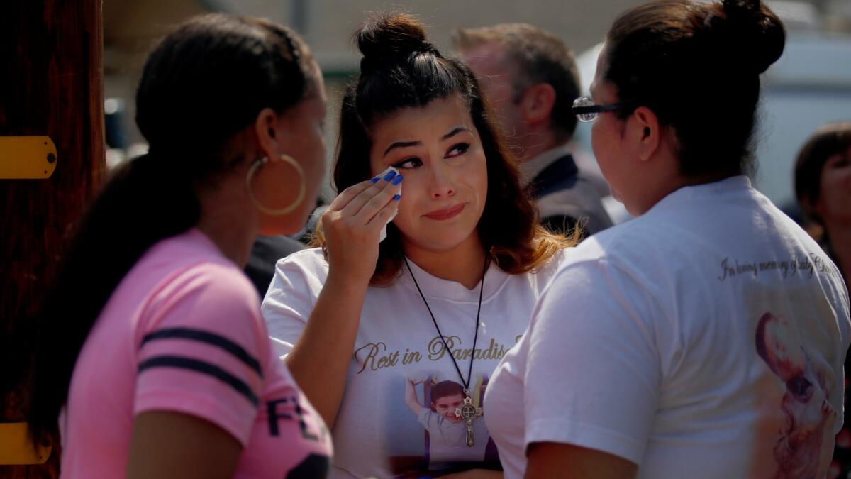 Coral Salvador dabs her eyes after a news conference in Altadena on Thursday where a $20,000 reward was announced for help in finding the killer of her 4-year-old son, Salvador Esparza III, on July 5.