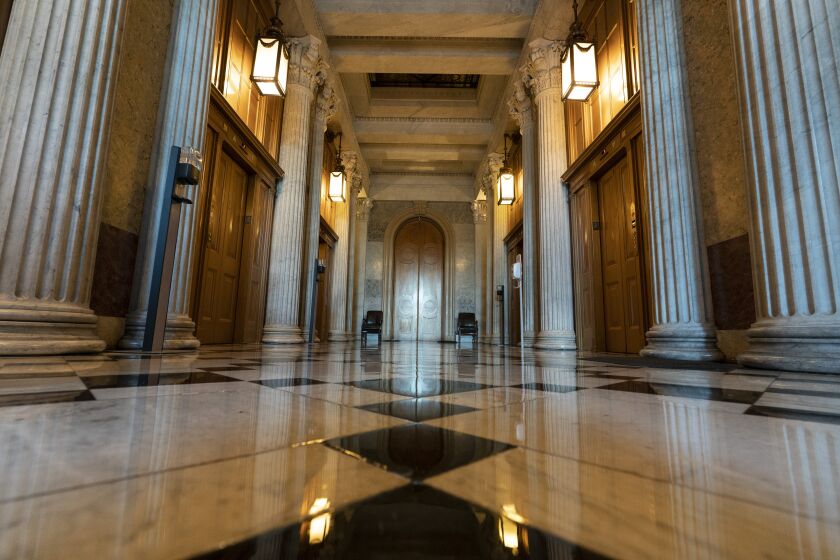 This June 30, 2021, photo shows the halls of the Capitol outside the Senate in Washington. The U.S. Capitol is still closed to most public visitors. It's the longest stretch ever that the building has been off-limits in its 200-plus year history. (AP Photo/Alex Brandon)