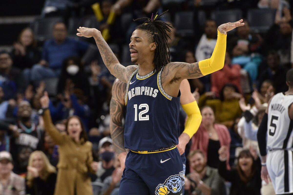 Morant dunks over 7-footer, scores 52 as Grizzlies top Spurs