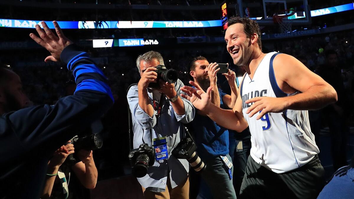 Tony Romo is introduced with the Dallas Mavericks starters before a game against Denver on April 11.
