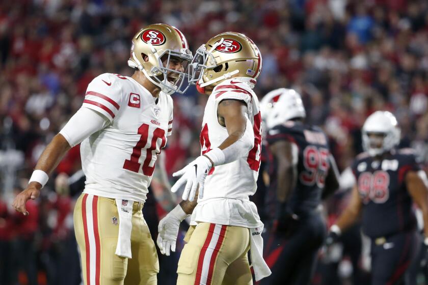 GLENDALE, ARIZONA - OCTOBER 31: Quarterback Jimmy Garoppolo #10 of the San Francisco 49ers celebrates with receiver Kendrick Bourne #84 after Bourne's touchdown catch against the Arizona Cardinals during the first half of the NFL football game at State Farm Stadium on October 31, 2019 in Glendale, Arizona. (Photo by Ralph Freso/Getty Images) ** OUTS - ELSENT, FPG, CM - OUTS * NM, PH, VA if sourced by CT, LA or MoD **
