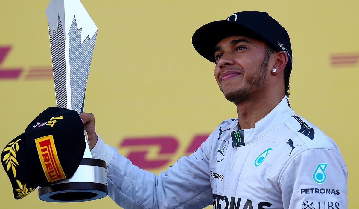 Lewis Hamilton celebrates on the podium after winning the Russian Grand Prix on Sunday in Sochi.
