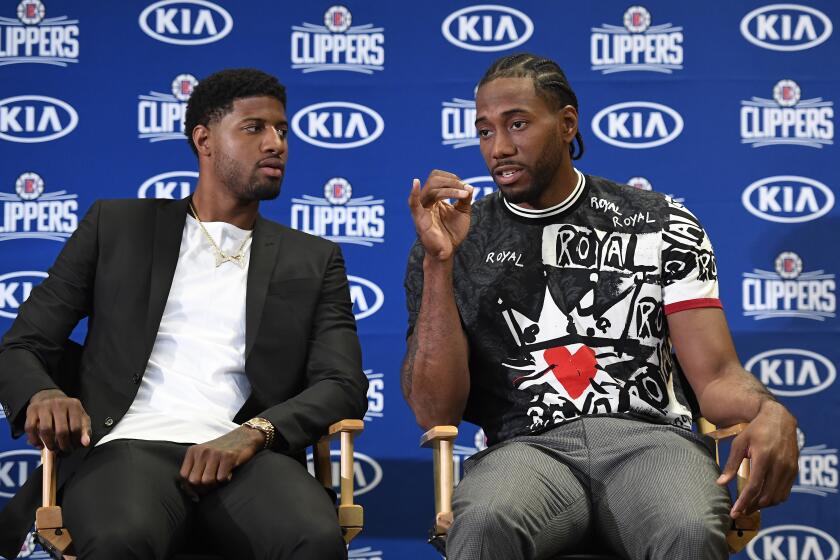 LOS ANGELES, CALIFORNIA - JULY 24: Paul George and Kawhi Leonard of the Los Angeles Clippers are introduced at Green Meadows Recreation Center on July 24, 2019 in Los Angeles, California. NOTE TO USER: User expressly acknowledges and agrees that, by downloading and or using this photograph, User is consenting to the terms and conditions of the Getty Images License Agreement. (Photo by Kevork Djansezian/Getty Images)