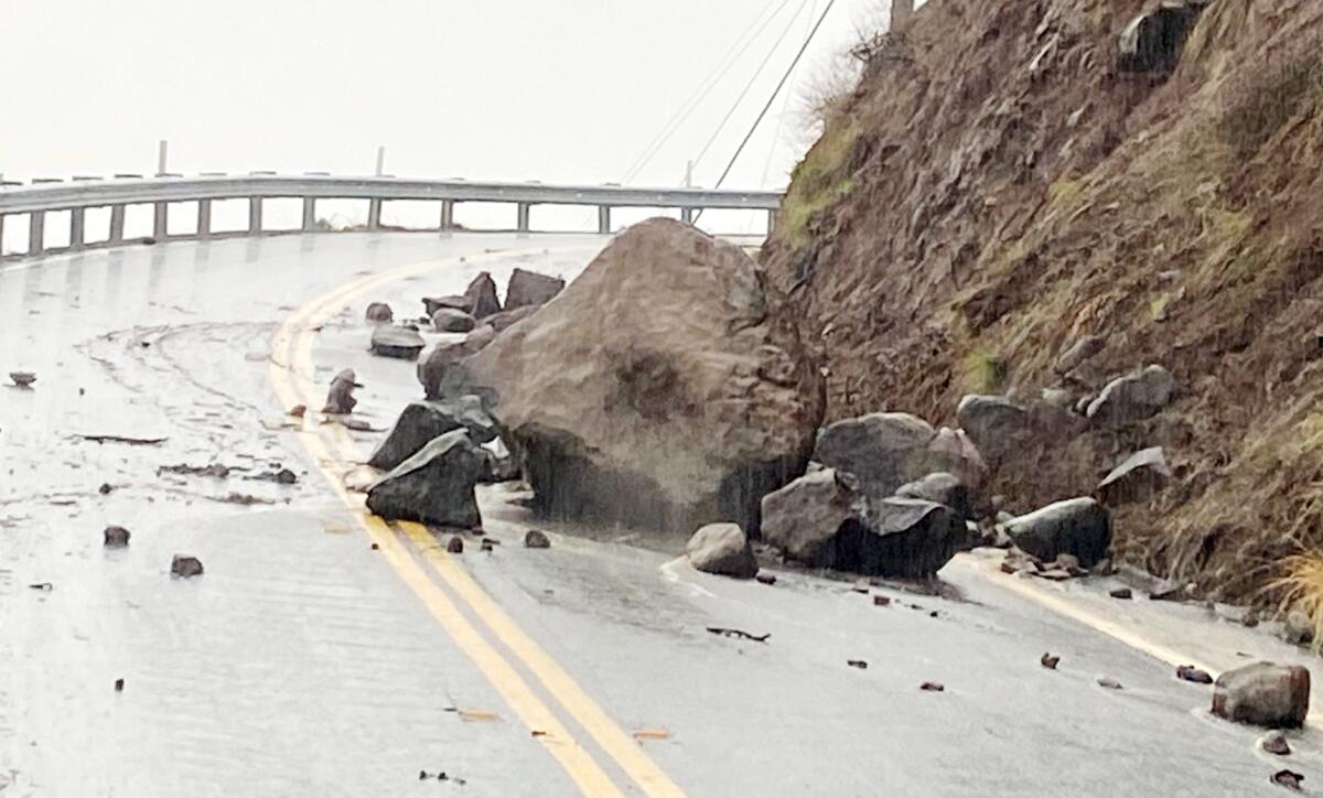 Decker Canyon Road in Malibu is blocked by rocks