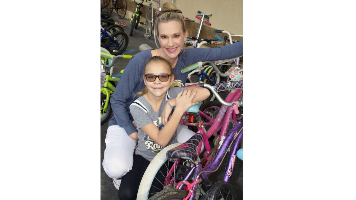 Lisa Matzner Eaton and her daughter Reese, made a donation of two bikes at last week's event that benefits Bike Angels and, ultimately, local kids who would otherwise not be able to afford bikes.