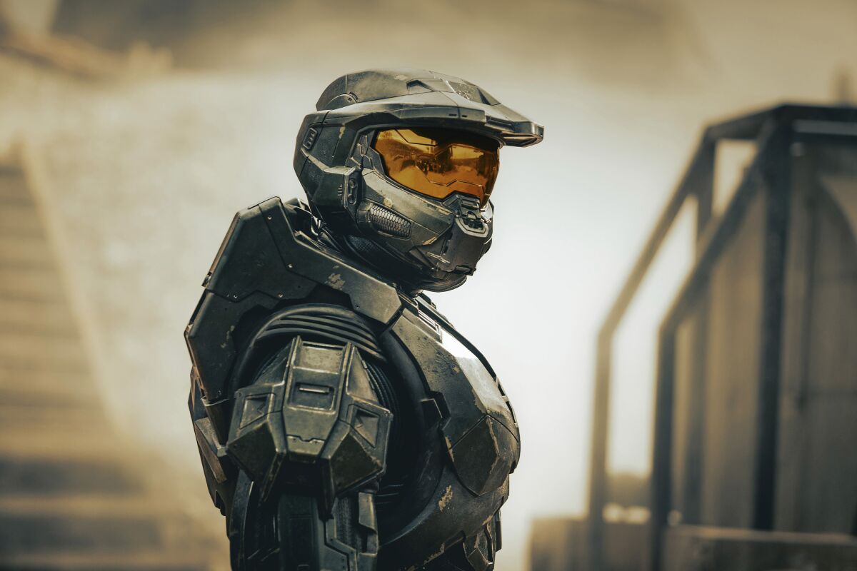 A man in an armored suit and helmet