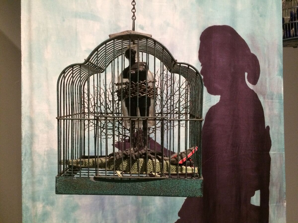 "The Edge of Ethics," foreground, and "Seated Shadow With Bird Cages" are part of retrospective at the Scottsdale Museum of Contemporary Art in Arizona.