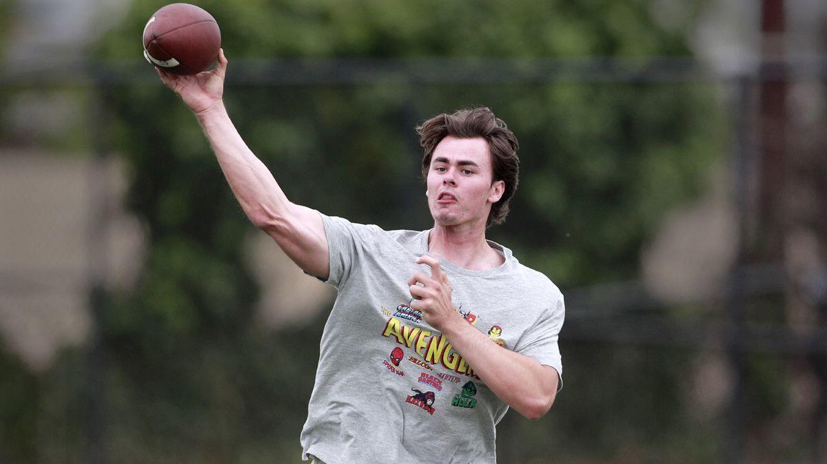 JT Daniels passes to his Mater Dei teammate and fellow USC freshman Amon-ra St. Brown at Golden West College in Huntington Beach on May 30, 2018.