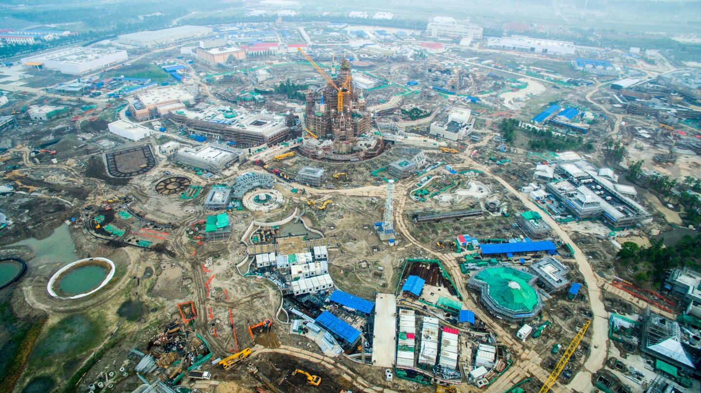 SHANGHAI, CHINA - Aerial view of Shanghai Disney Resort on July 15, 2015 in Shanghai, China. As the first Disney resort in China mainland, Shanghai Disney Resort includes the Magic Kingdom-style theme park, two themed hotels with a total of 1,220 rooms, a retail, dining and entertainment complex featuring a Broadway-style theater, as well as an outdoor recreational area. The Resort will open officially in 2016.