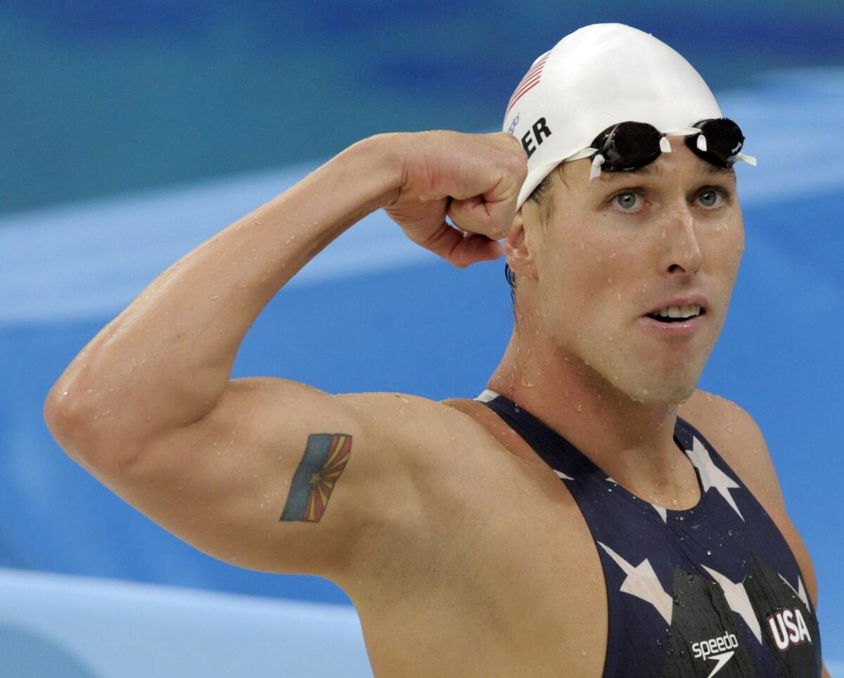 Klete Keller reacts after a men's 800 meter freestyle relay heat.