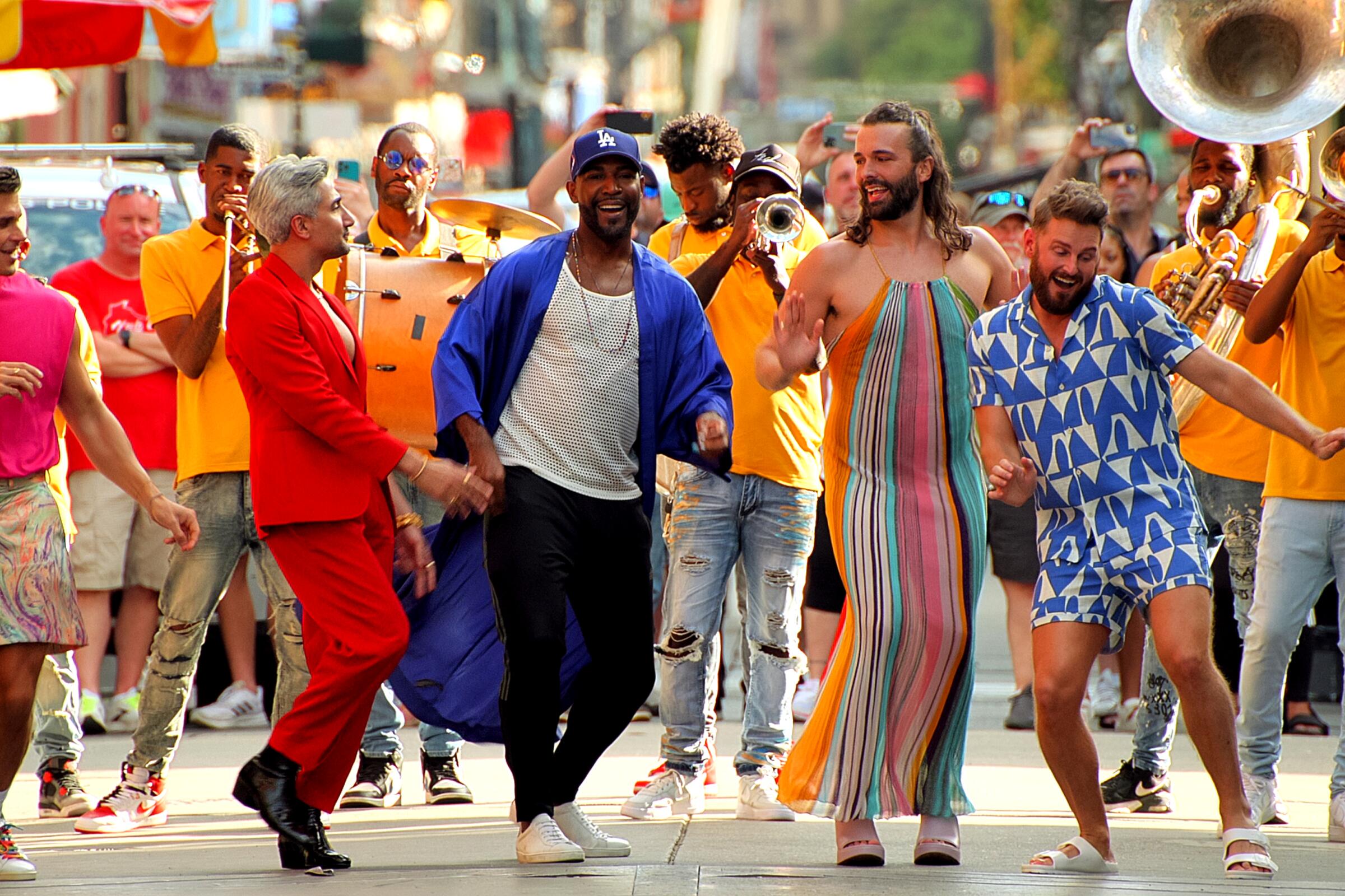 "Queer Eye's" Fab Five dance in the street ahead of a brass band in New Orleans.