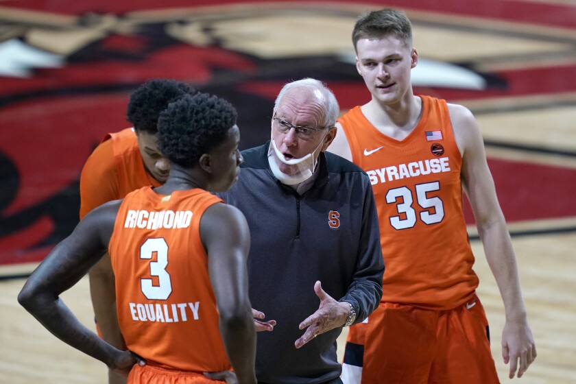 FILE - In this Saturday, Dec. 12, 2020, file photo, Syracuse head coach Jim Boeheim instructs his players during the second half of an NCAA college basketball game against Boston College, in Boston. Syracuse won the last two games on its revised regular-season schedule to remain in the hunt for a bid to the NCAA Tournament. (AP Photo/Elise Amendola, File)