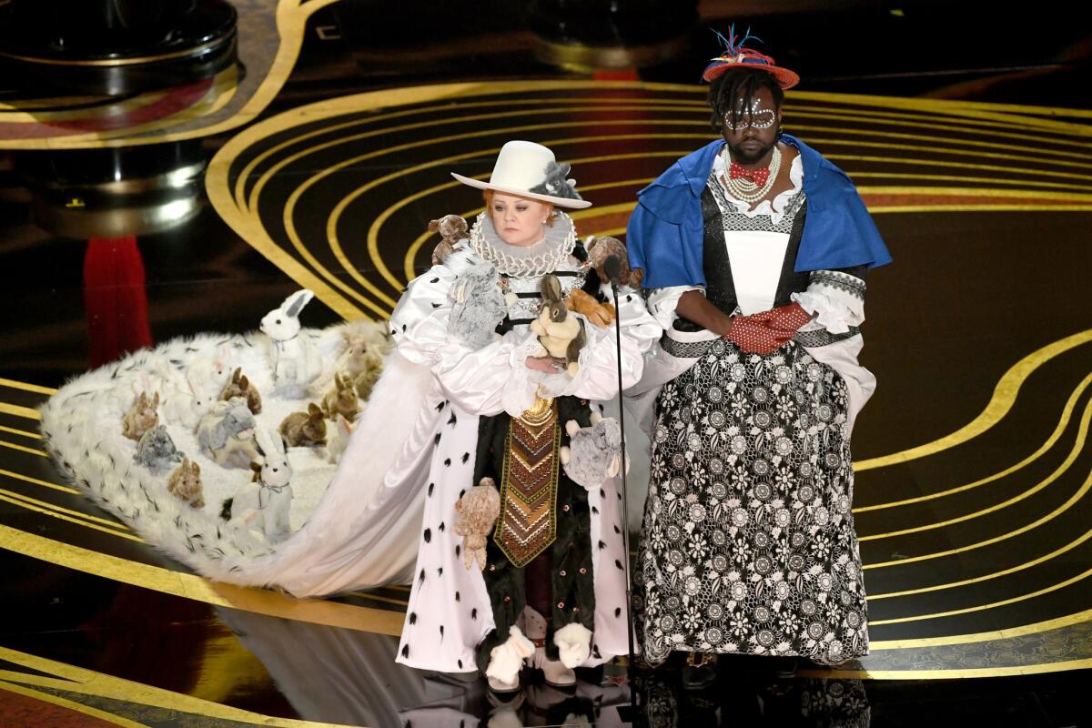 Melissa McCarthy, left, and Brian Tyree Henry onstage in spoof costumes during the 91st Academy Awards.