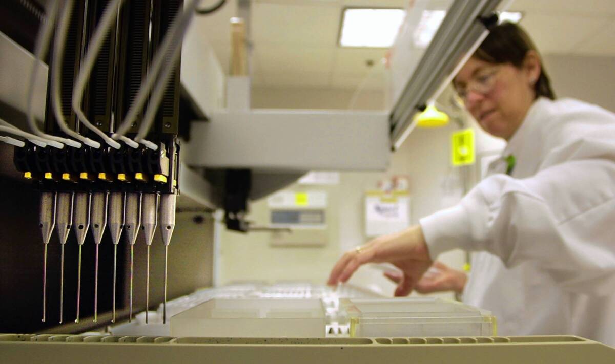 A technician loads samples into a machine for testing at Myriad Genetics, which lost a Supreme Court case over patenting the BRCA genes, which can show a woman’s breast and ovarian cancer risk.