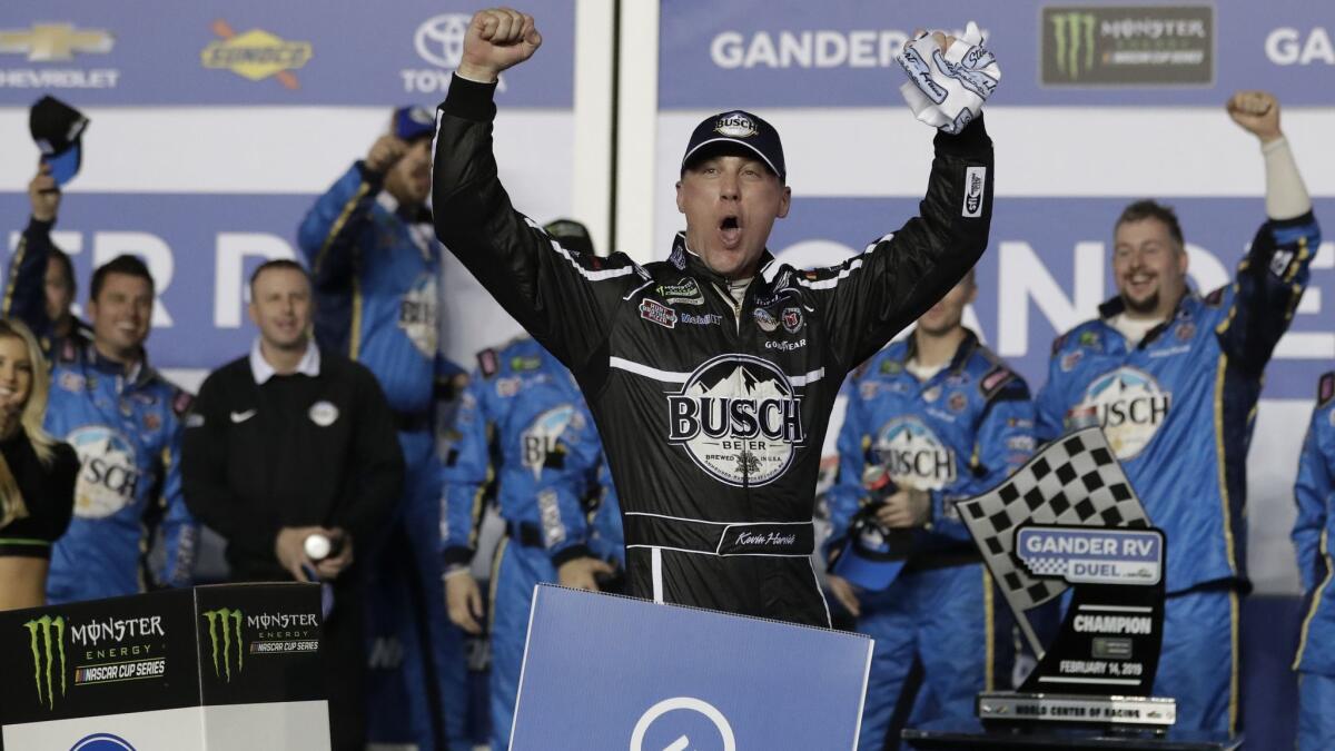 Kevin Harvick celebrates in victory Lane after winning the first of two qualifying auto races for the NASCAR Daytona 500 at Daytona International Speedway on Thursday in Daytona Beach, Fla.