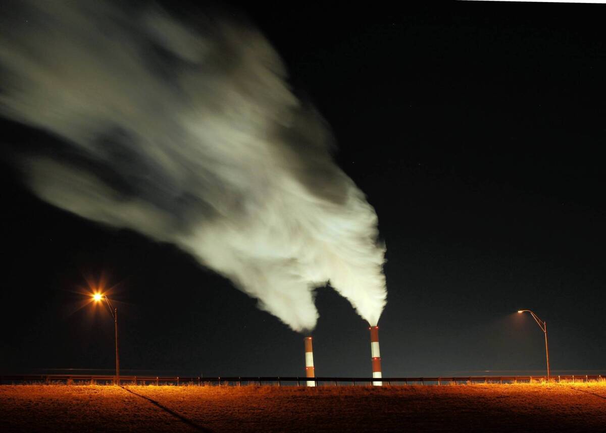 The president has proposed stricter standards for coal-fired power plants such as the one in Kansas pictured here.