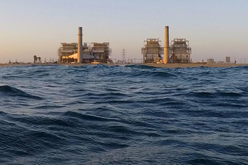 HUNTINGTON BEACH, CA -- FRIDAY, AUGUST 12, 2016: A view of the AES Huntington Beach Generating Station in Huntington Beach. Residents for Responsible Desalination aka R4RD, say the proposed Poseidon Desalinization project , which will be located next to the power plant, will kill marine life, pollute the ocean, is expensive and the technology is obsolete. The State Water Board has ruled that all generating stations must stop using the marine life-killing technique by 2020. The California Coastal Commission will be voting on the issue in September. Photo take on Aug. 12, 2016. Allen J. Schaben / Los Angeles Times