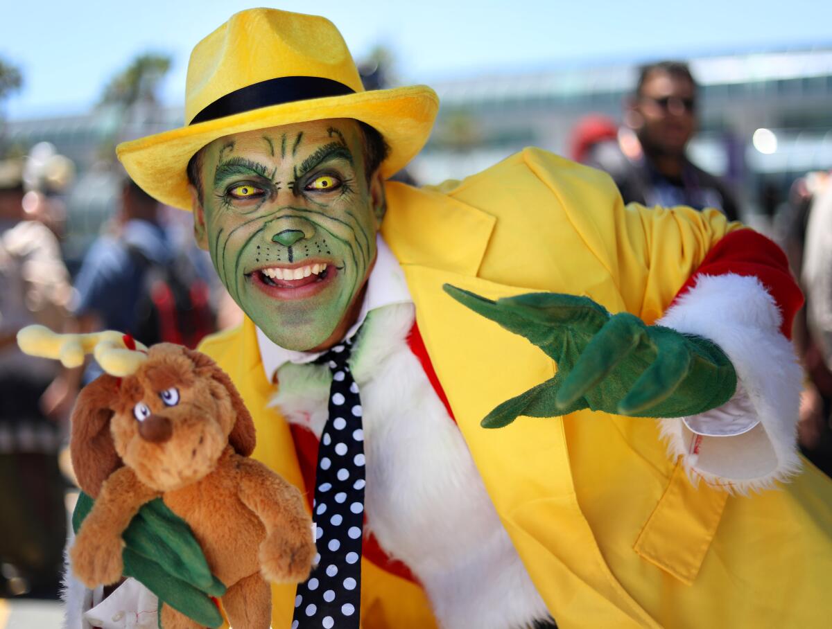 David Perez of Sacramento salutes Jim Carrey as The Mask That Stole Christmas at Comic-Con International in San Diego on July 20, 2019.
