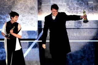 Brian VanderBrug x23486 -- - 078269.CA.0229.oscars.BRV --Ngila Dickson (L) and Richard Taylor of New Zealand accept the Oscar for achievement in costume design during the 76th annual Academy Awards at the Kodak Theatre in Hollywood February 29, 2004. Dickson and Taylor won for their work in the "The Lord of the Rings: The Return of the King.L