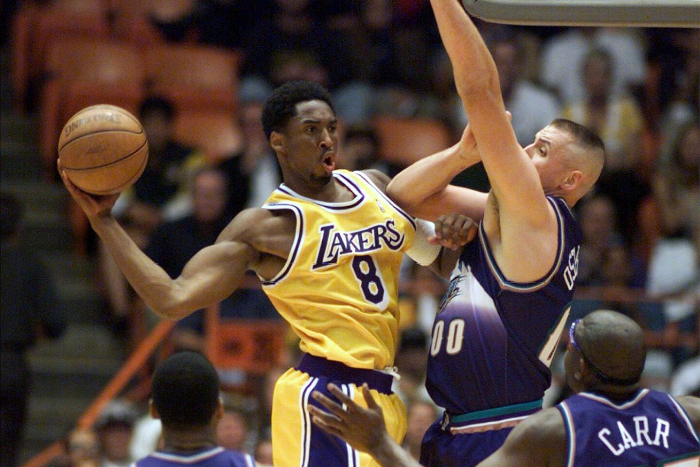 Utah Jazz forward Karl Malone makes an off-balance shot against San Antonio  Spurs forward Charles Smith in the first period Saturday, May 11, 1996, in  Salt Lake City. Malone matched his jersey