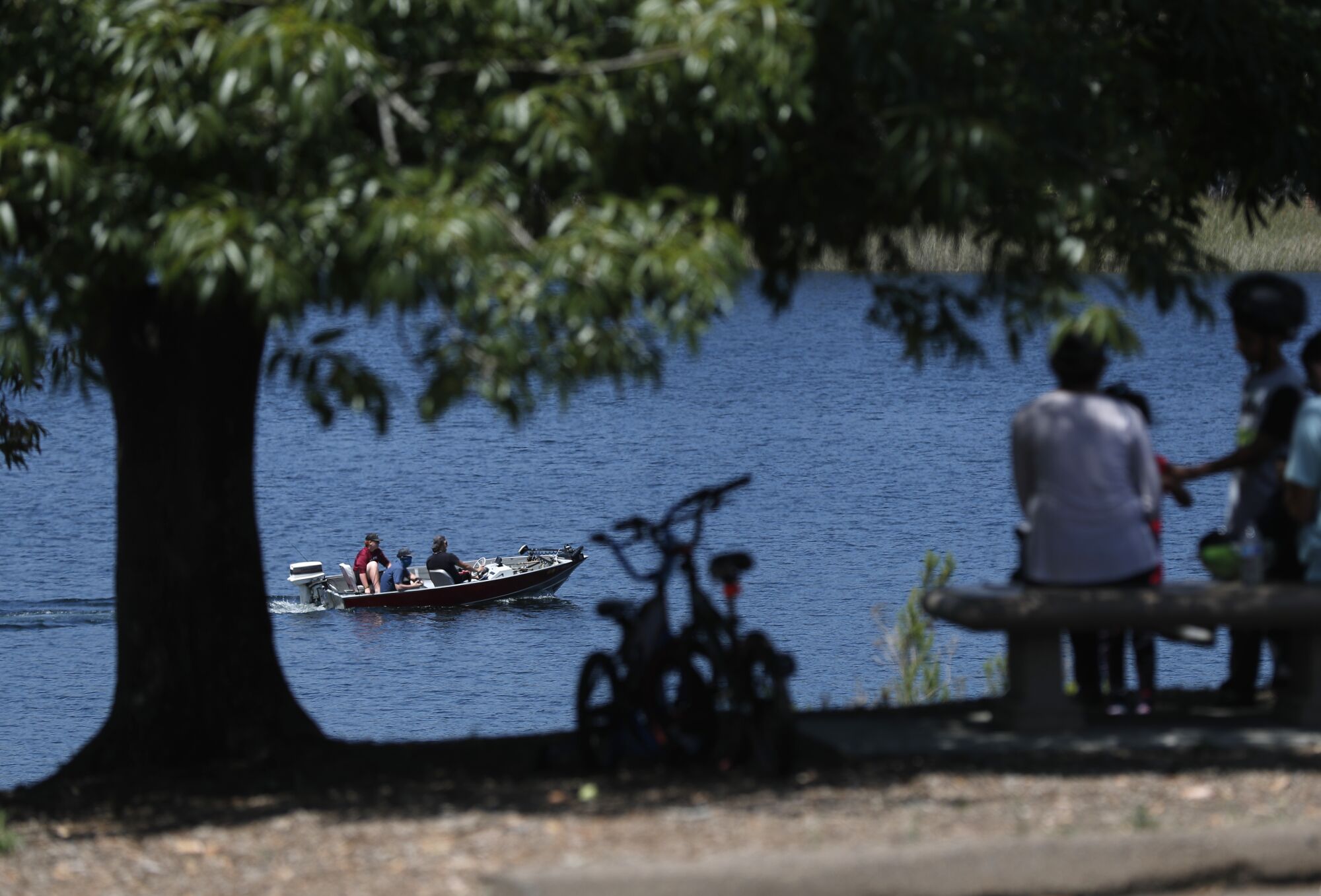 Fisherman head out on Lake Miramar on May 17