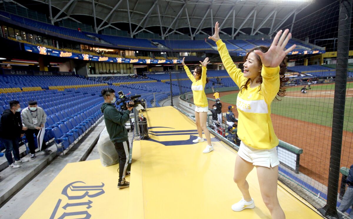 Cheerleaders dance during a game at Taichung International Baseball Stadium on April 12.