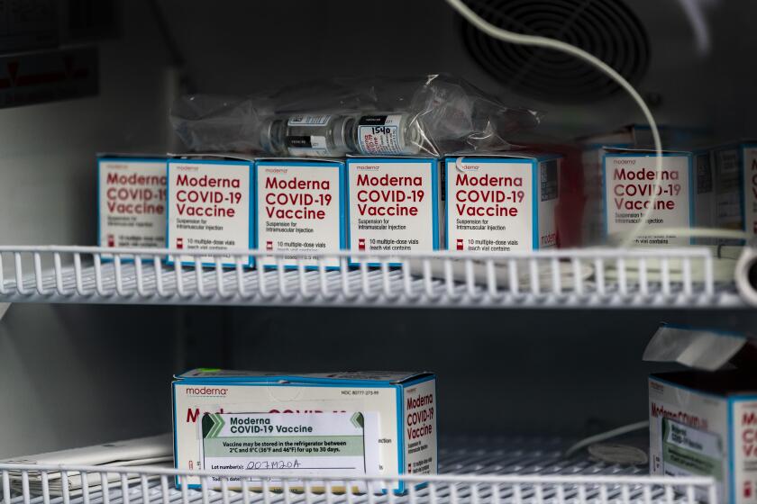 RIVERSIDE, CA - FEBRUARY 1, 2021: Vials of Moderna COVID-19 vaccine sit in a refrigerator inside a Curative van at the vaccination site in the parking lot of the Riverside Convention Center on February 1, 2021 in Riverside, California. Currently, this site is capable of giving 500 vaccinations a day in one of the regions hardest hit by the pandemic. Only residents 65 and older and educators are eligible for the vaccination here. The vials must be stored in refrigeration between 2°C and 8°C (36°F and 46°F) for up to 30 days. (Gina Ferazzi / Los Angeles Times)