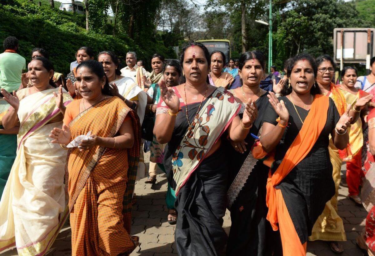 Hindu devotees shouted slogans praising the deity Ayyappa during a protest against the Indian Supreme Court verdict revoking a ban on women's entry to the Sabarimala temple.
