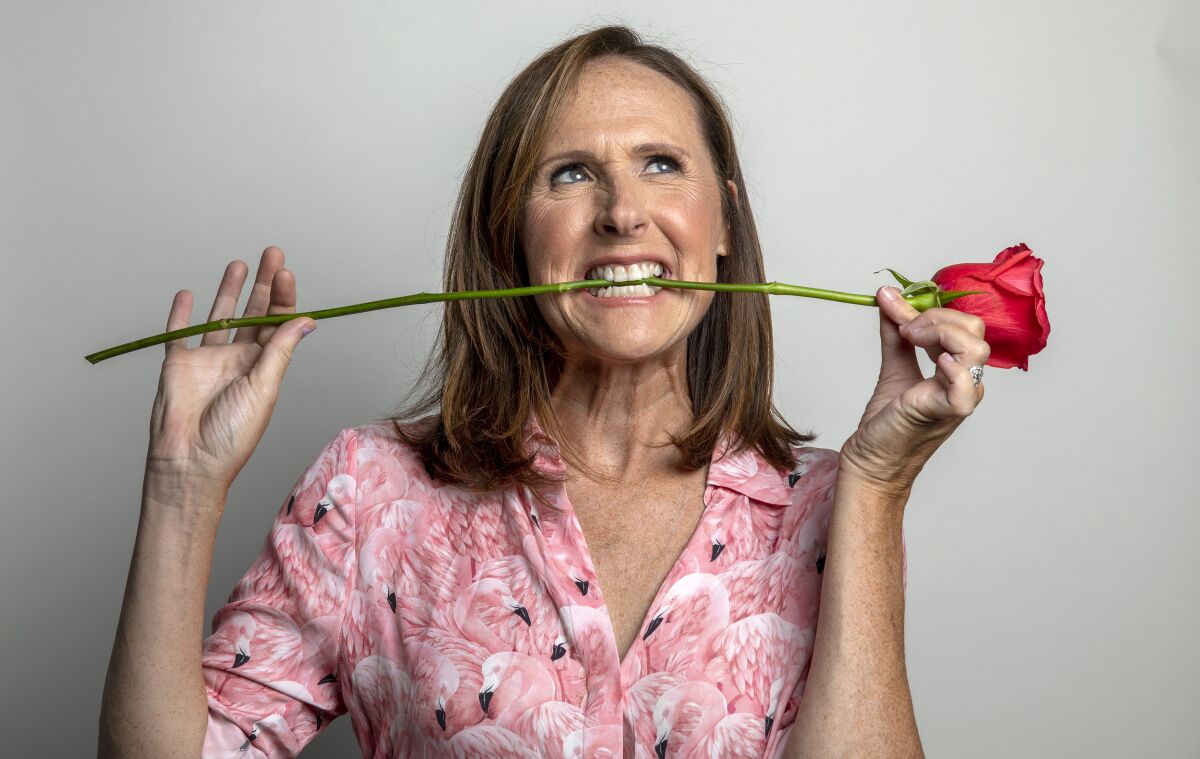 Molly Shannon poses with a rose between her teeth