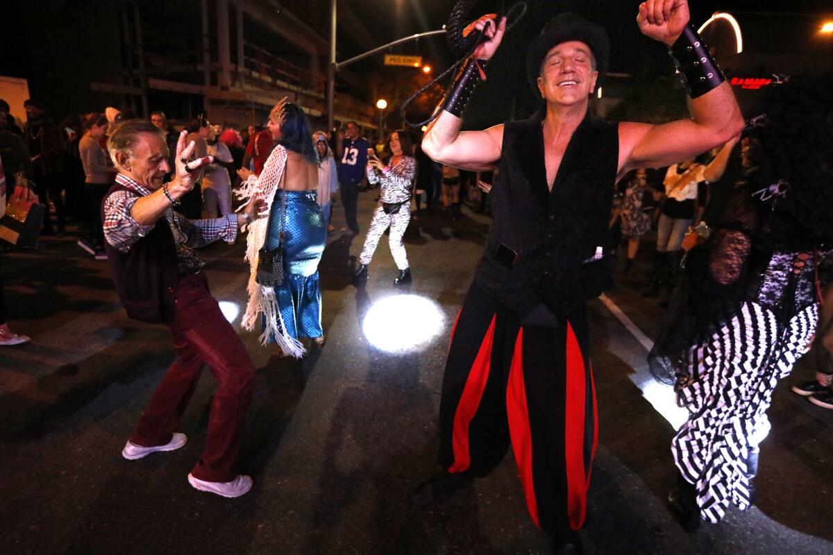 Costumed revelers participate in the annual Halloween Carnaval.