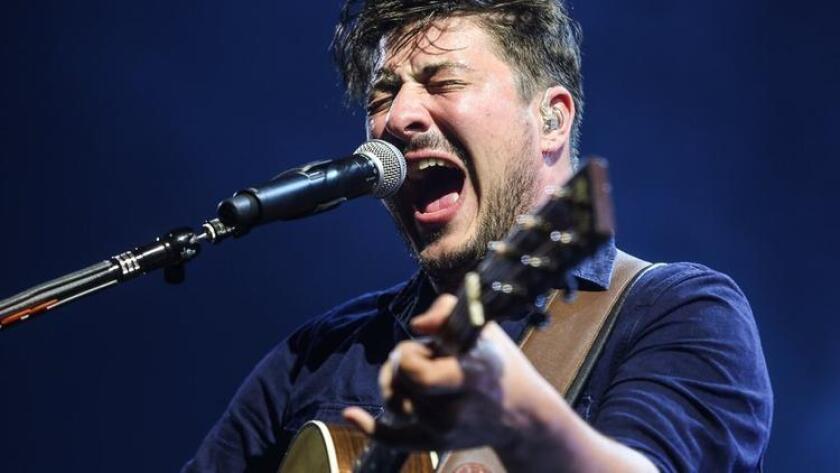FILE - In this Aug. 17, 2015, file photo, Marcus Mumford of Mumford & Sons performs in Inglewood, Calif. Mumford, the B-52s, Jennifer Hudson and Sister Sledge will be featured at the Songwriters Hall of Fame induction and awards dinner in New York City on June 9, 2016. (Photo by Rich Fury/Invision/AP, File) (/ The Associated Press)